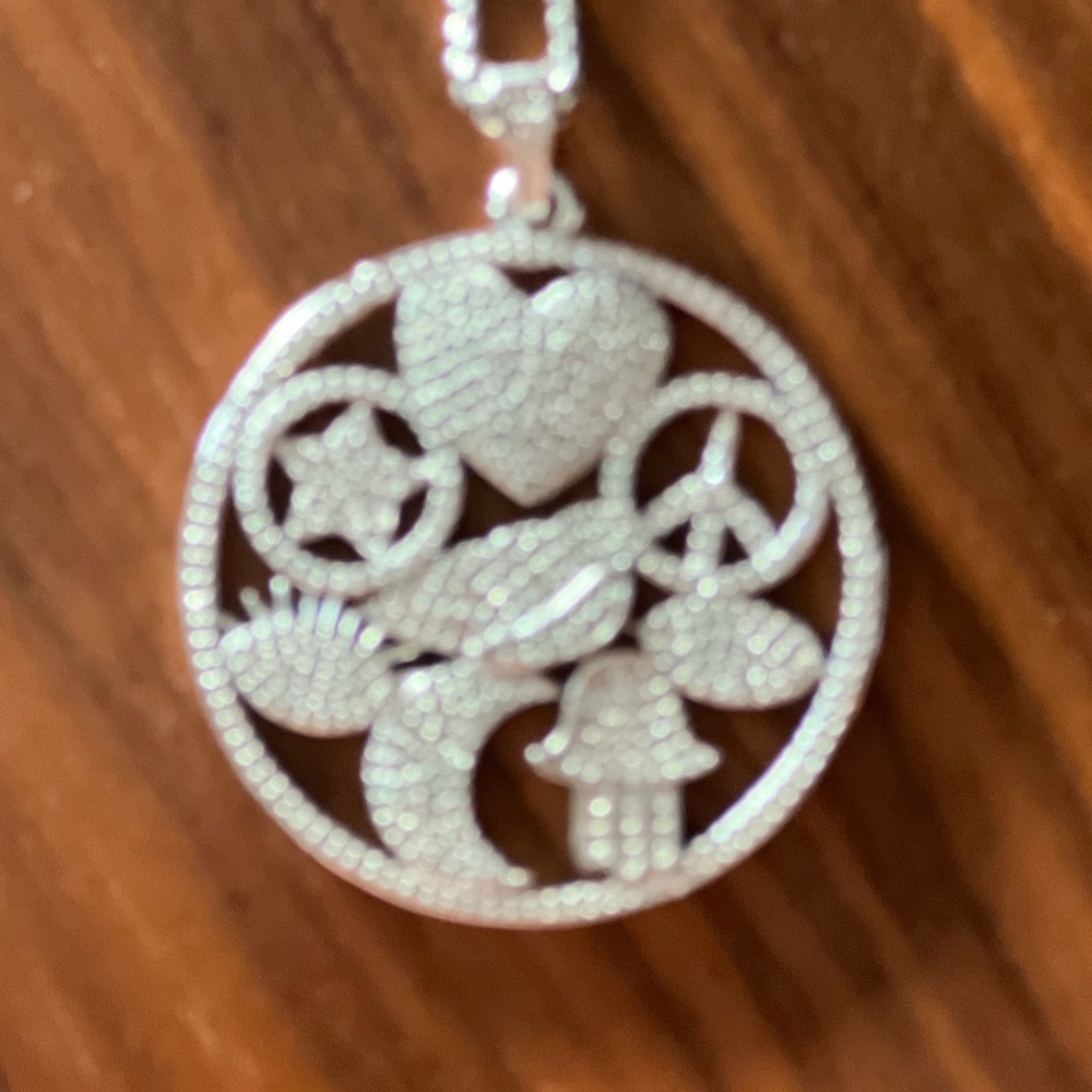 Fun silver with diamanté pendant. Symbols of peace and love. Chain not included.
